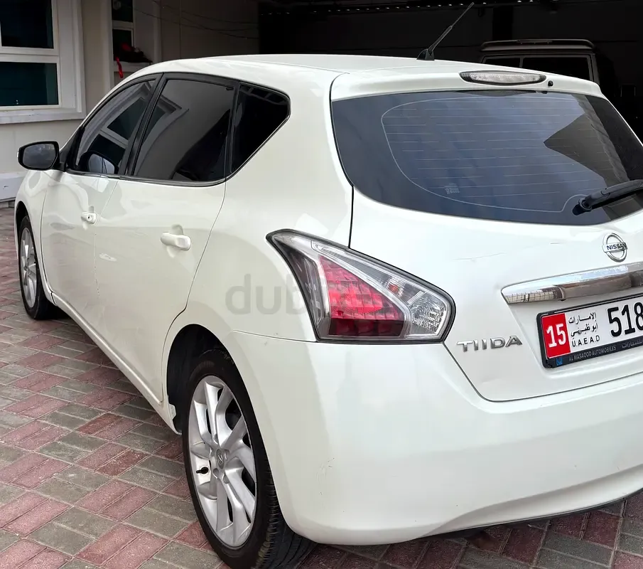 Nissan Tiida - фото 1